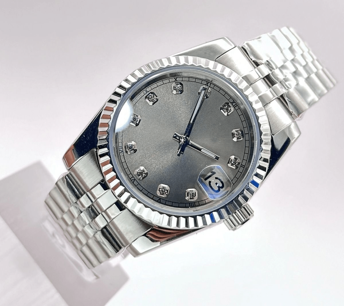 silver diamond index Seiko mod automatic watch with stainless steel bracelet, product shot angle shot