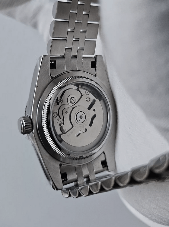 exhibition caseback of Roman dial stainless steel Seiko NH35 mod watch, movement visible