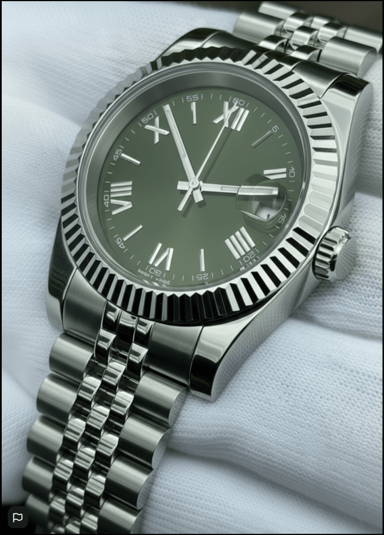 green Roman dial stainless steel Seiko NH35 mod watch on jubilee bracelet, front view on white background