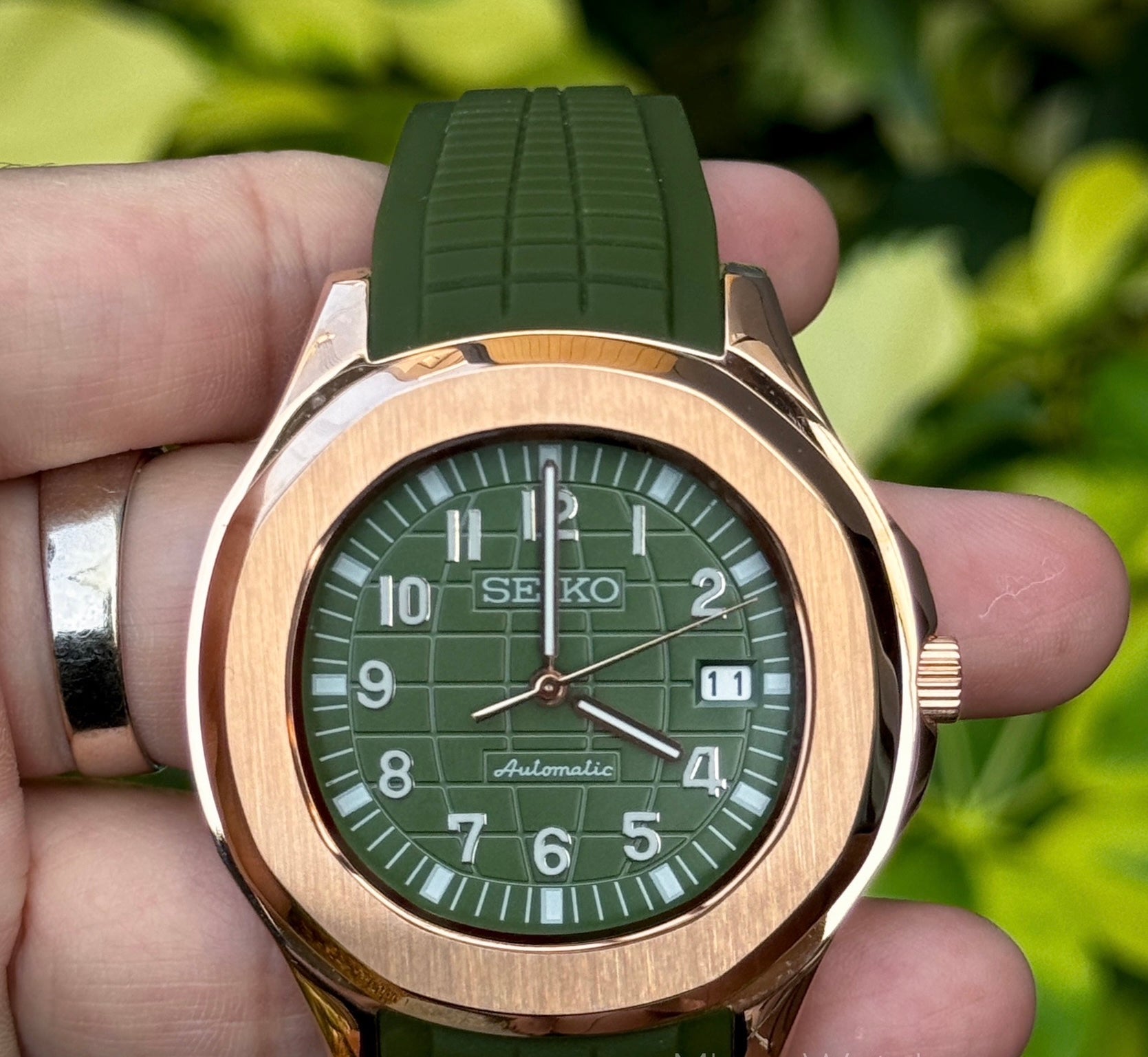rose gold green seiko mod green dial close up
