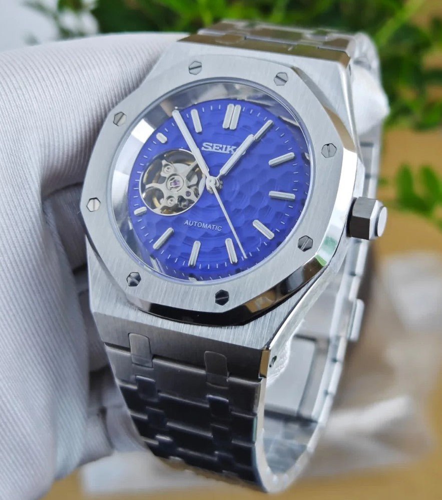 seiko mod royal oak style blue dial open heart window close-up showing NH38 automatic movement