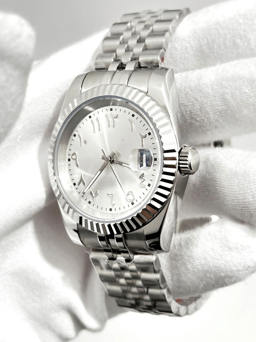 silver Arabic Seiko mod automatic watch with stainless steel bracelet, angle shot