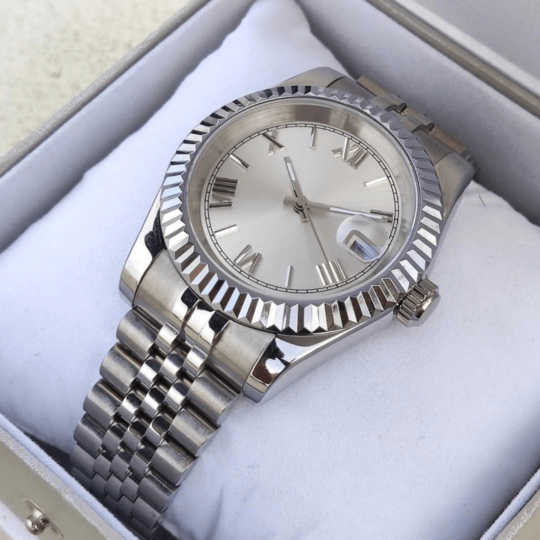 white Roman dial stainless steel Seiko mod watch on jubilee bracelet presented in watch box on cushion