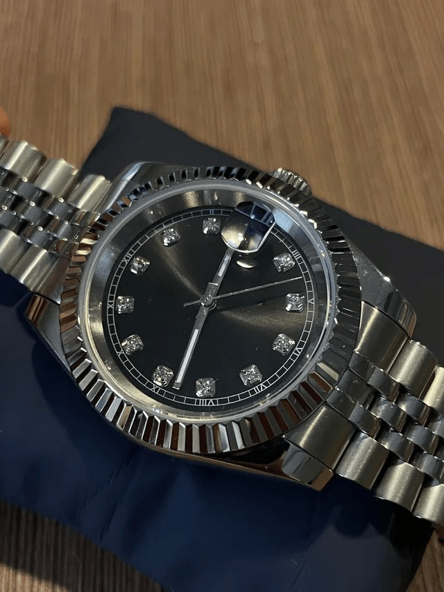 black diamond index Seiko mod automatic watch with stainless steel bracelet, product shot