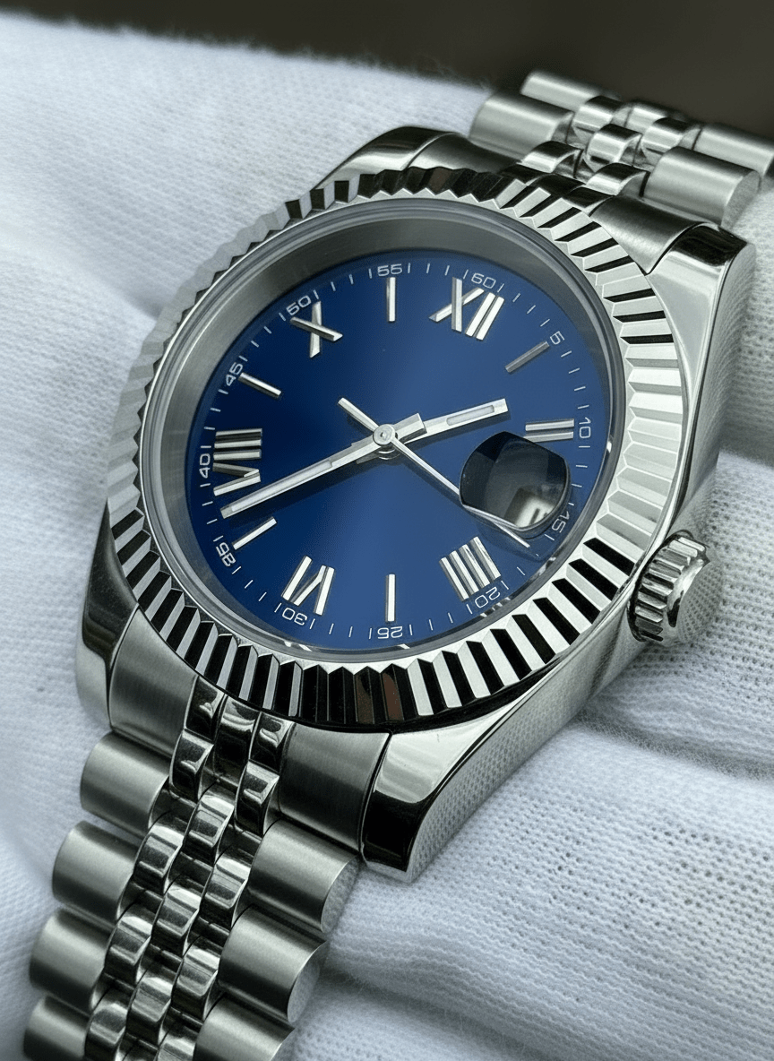 blue Roman dial stainless steel Seiko mod watch lying on white cloth, angled close-up