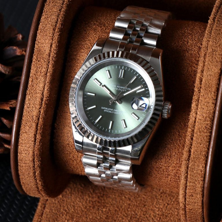 angled close-up of olive green sunburst dial Seiko mod watch showing date window and fluted bezel