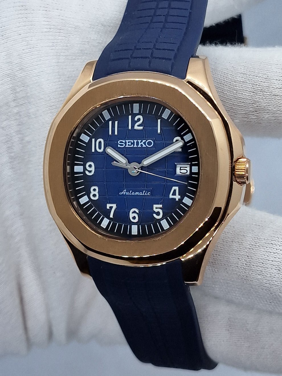 rose gold blue seiko mod nautiko on wrist